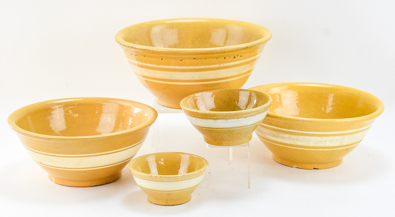 FIVE 'DANDY LINE' YELLOW WARE BOWLS