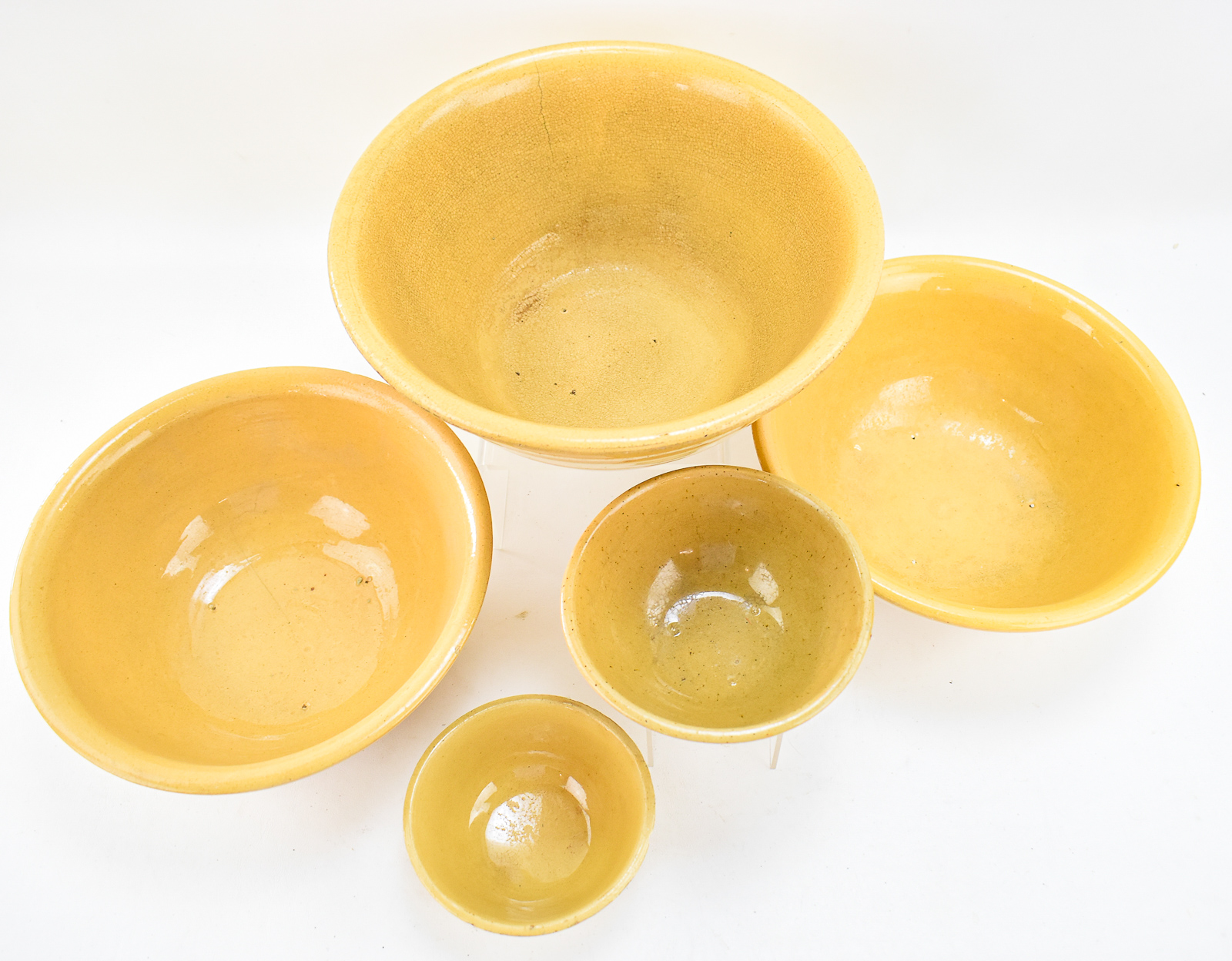 FIVE 'DANDY LINE' YELLOW WARE BOWLS