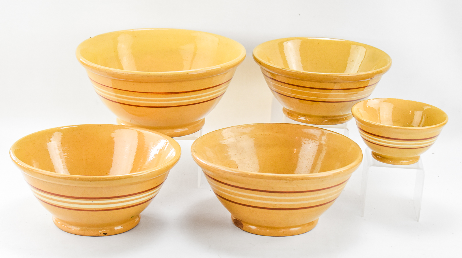 ASSORTMENT OF FIVE BANDED YELLOW WARE BOWLS