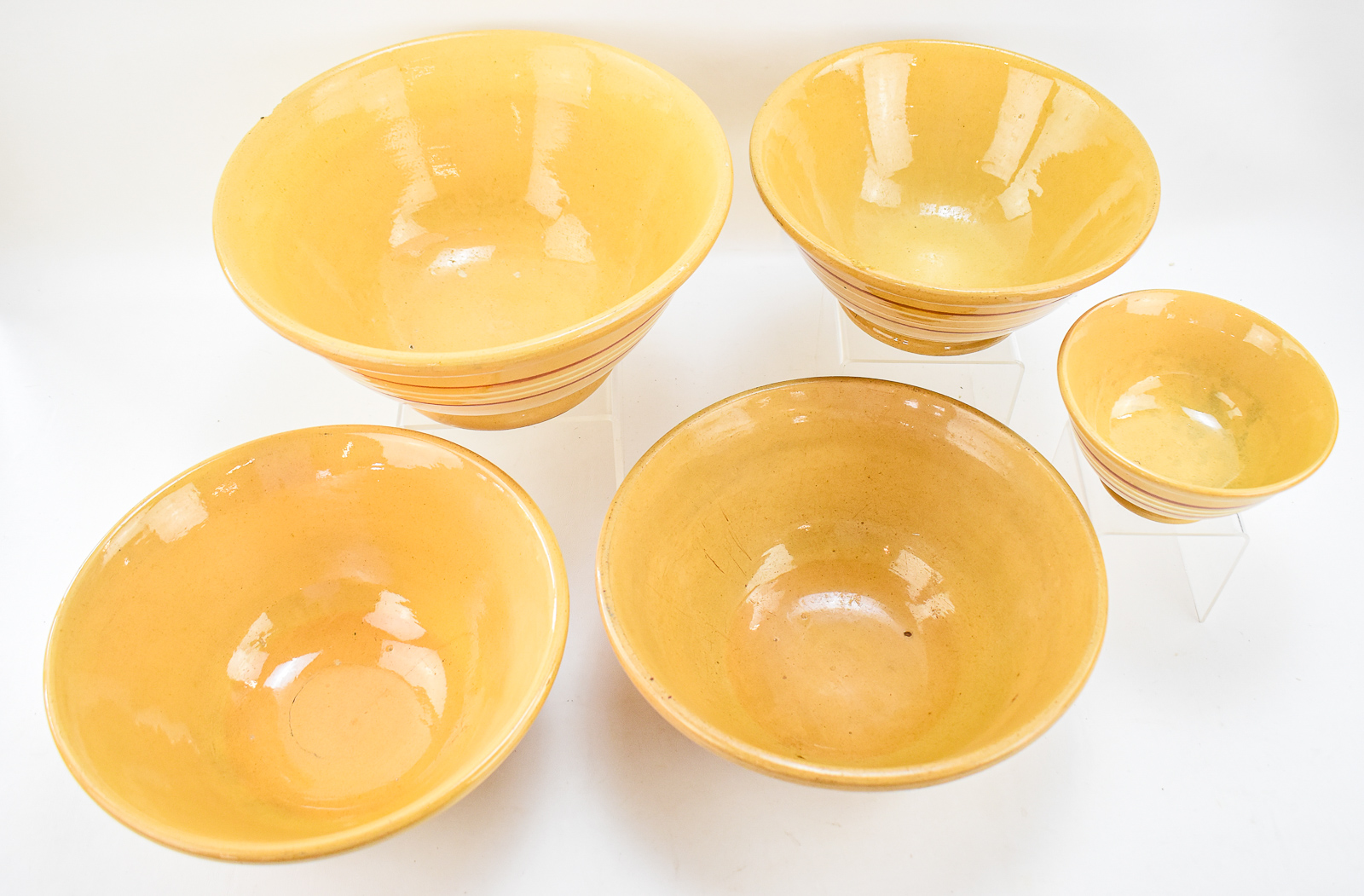 ASSORTMENT OF FIVE BANDED YELLOW WARE BOWLS