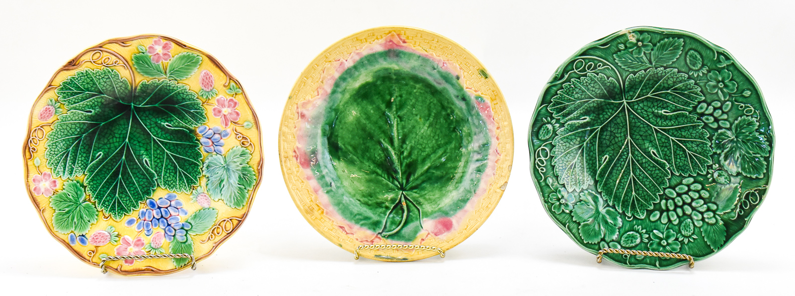 THREE 'VINE AND STRAWBERRY' MAJOLICA PLATES: WEDGWOOD, ETRUSCAN, AND MORE