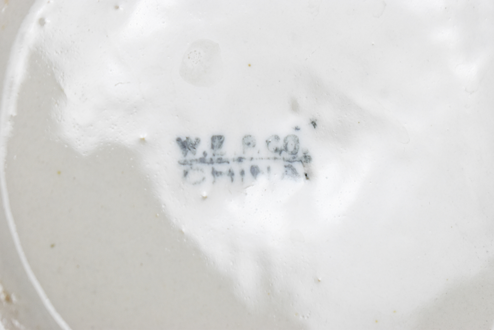 FIVE WHITE IRONSTONE MILK PITCHERS: WALKER CHINA, WEST END POTTERY, AND MORE