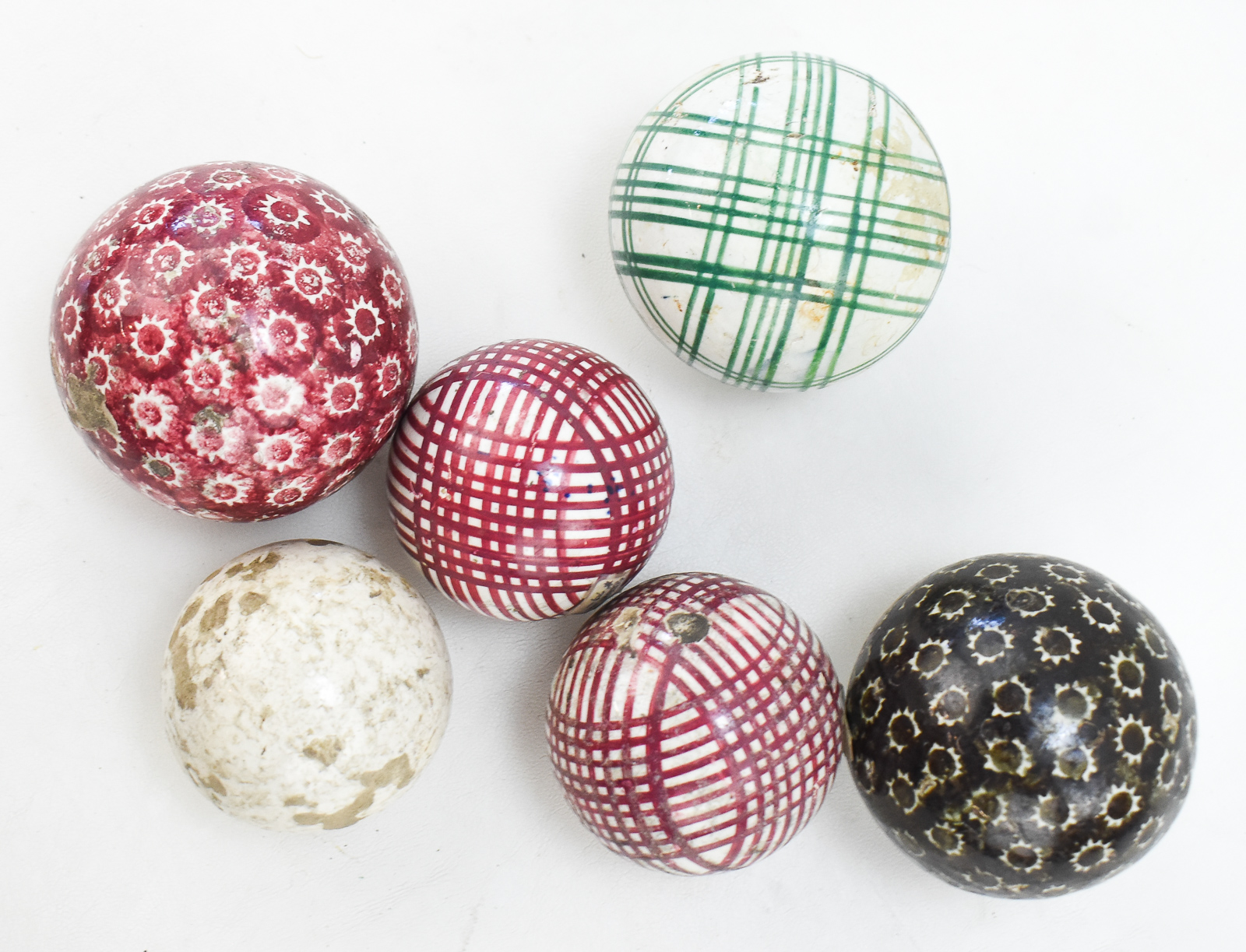 SIX VICTORIAN CARPET BALLS: 'CROSS-HATCH' AND 'SUN BURST' PATTERN