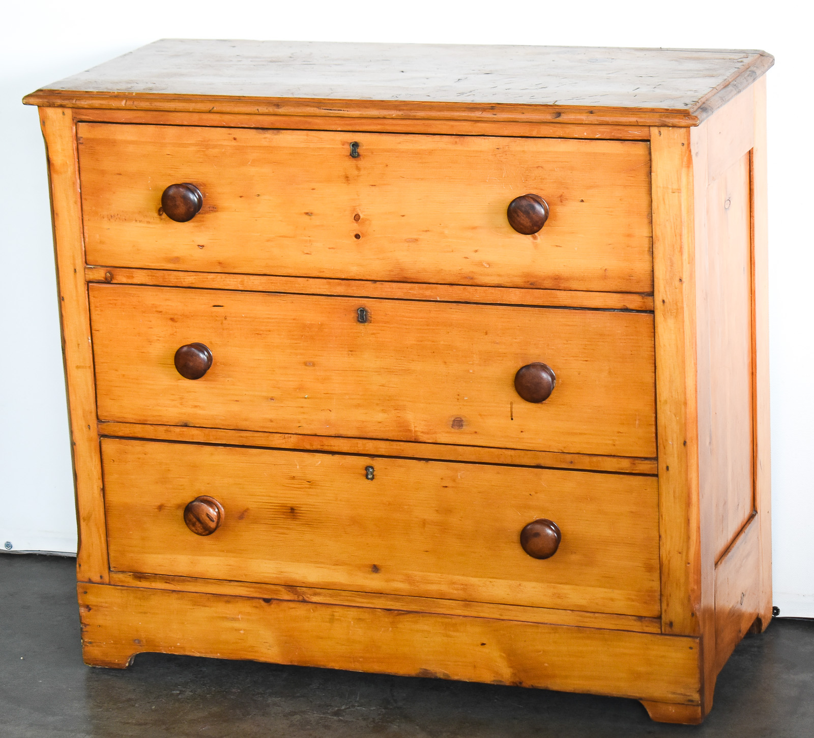 KNOTTY PINE THREE-DRAWER CHEST OF DRAWERS