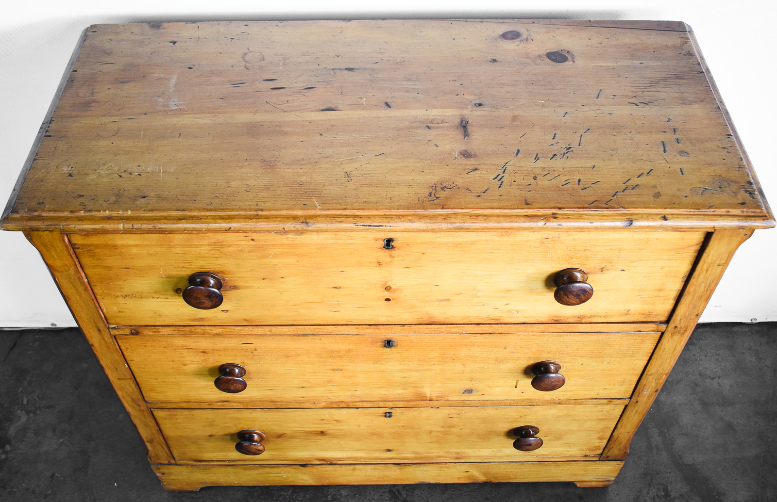 KNOTTY PINE THREE-DRAWER CHEST OF DRAWERS
