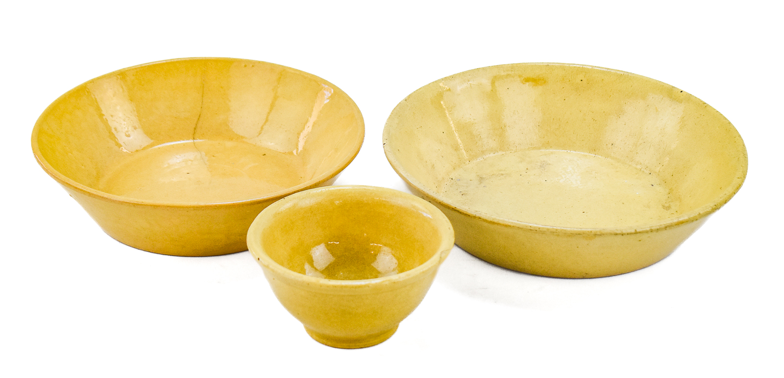 TRIAD OF YELLOW WARE BOWLS