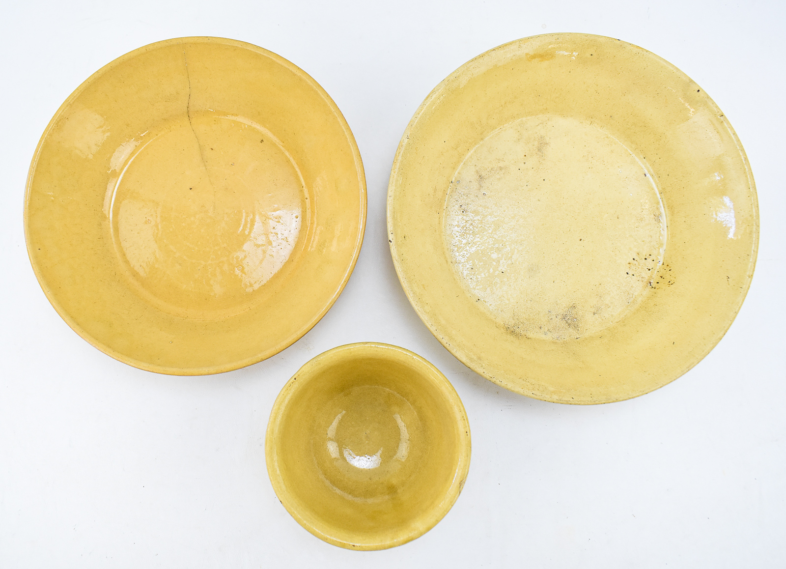 TRIAD OF YELLOW WARE BOWLS