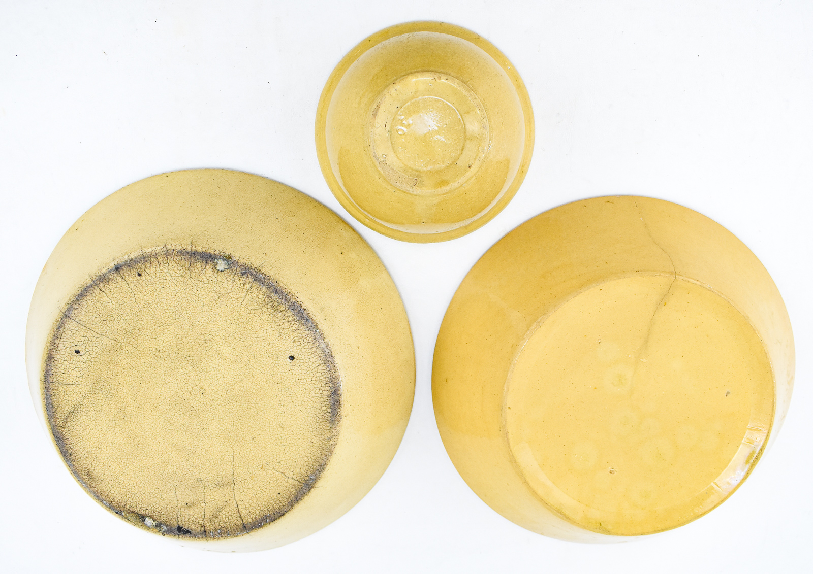 TRIAD OF YELLOW WARE BOWLS