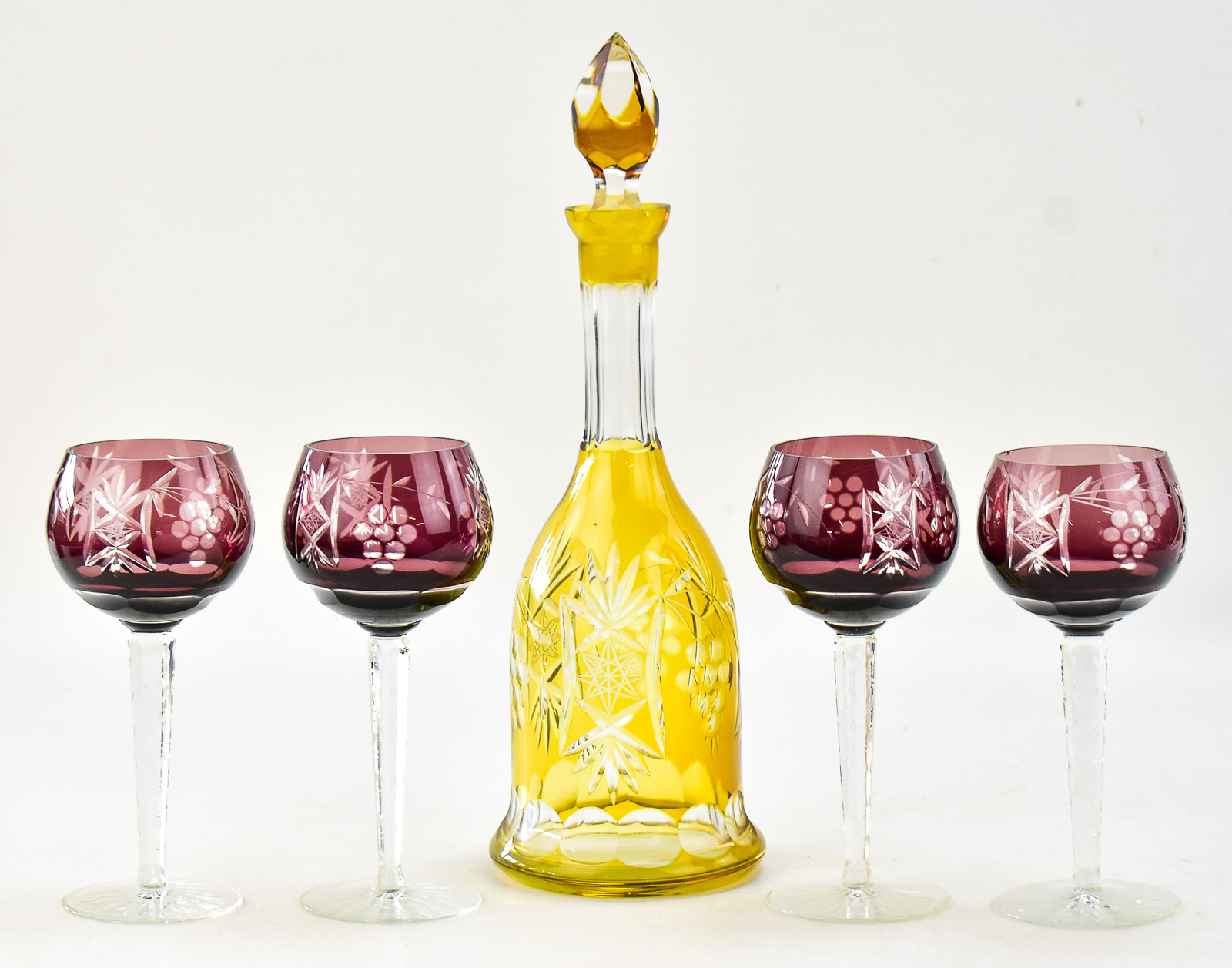BOHEMIAN TOPAZ CUT-TO-CLEAR GLASS DECANTER AND FOUR AMETHYST HOCK GLASSES