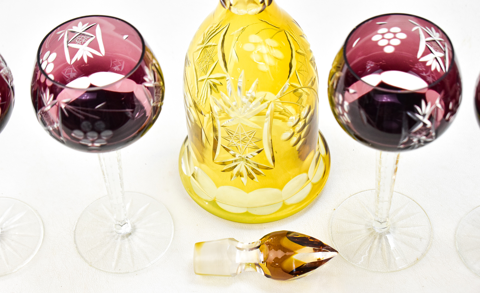 BOHEMIAN TOPAZ CUT-TO-CLEAR GLASS DECANTER AND FOUR AMETHYST HOCK GLASSES