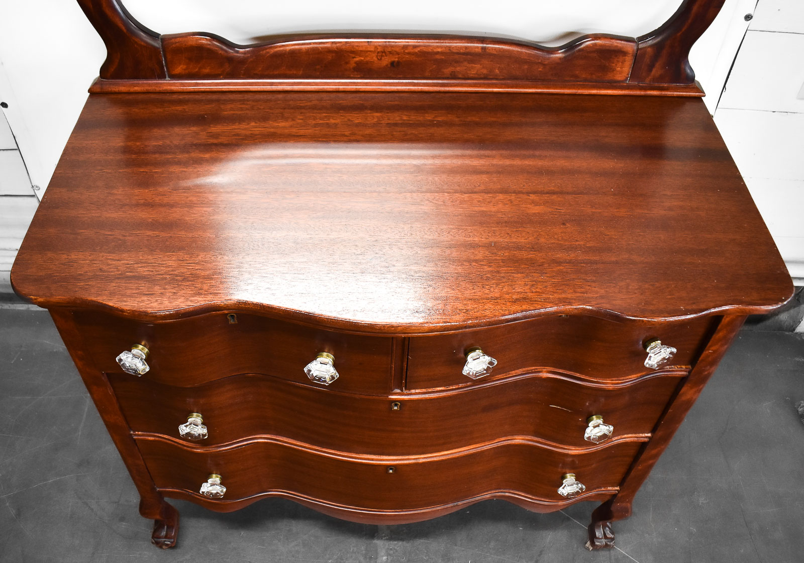 MAHOGANY SERPENTINE DRESSER WITH WISHBONE MIRROR
