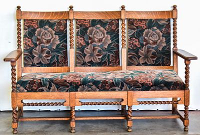 JACOBEAN REVIVAL STYLE SETTEE. A three-chair-back quarter sawn oak settee with Jacobean Revival 