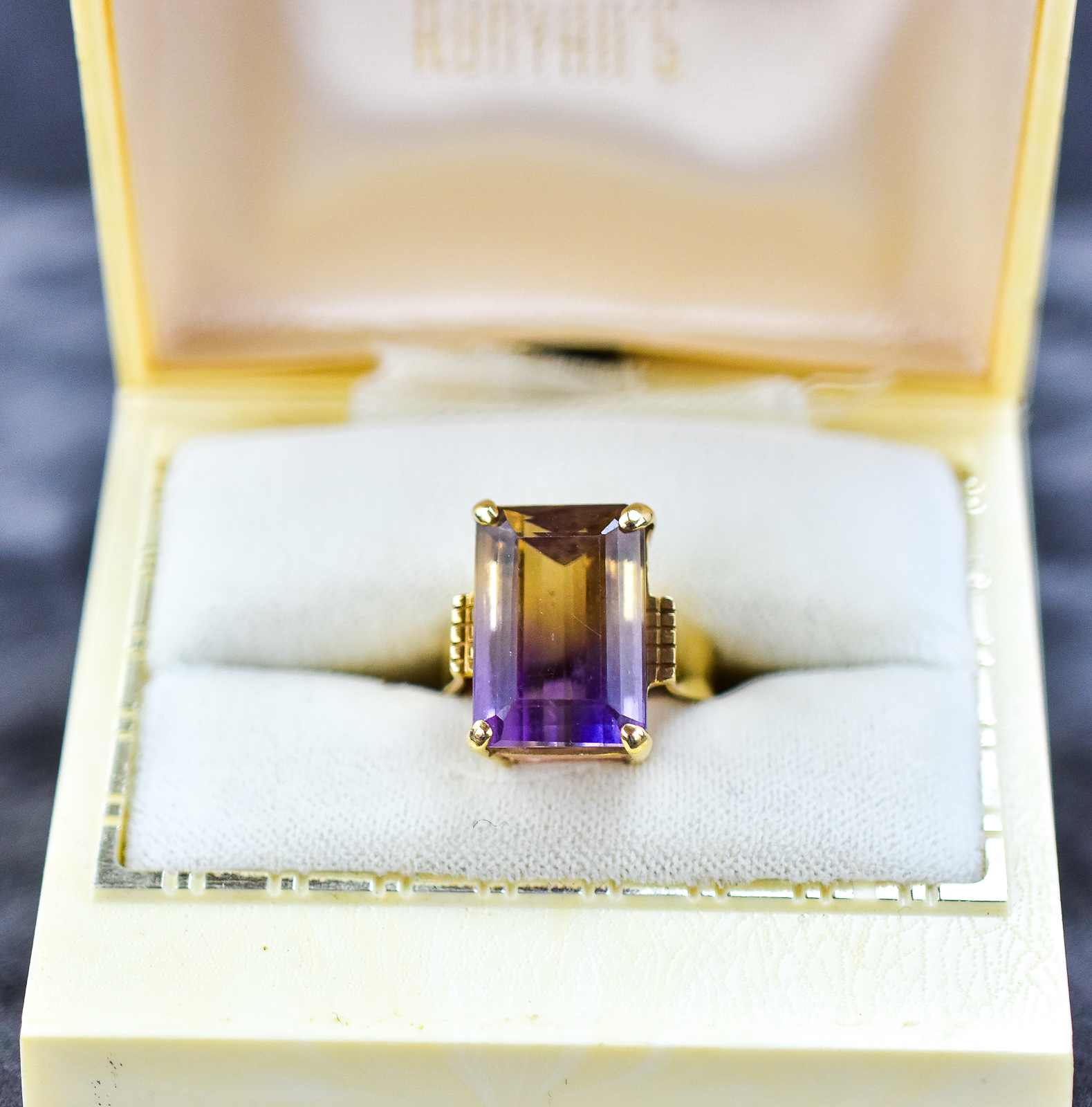 14KT GOLD & EMERALD CUT TOPAZ SOLITAIRE RING
