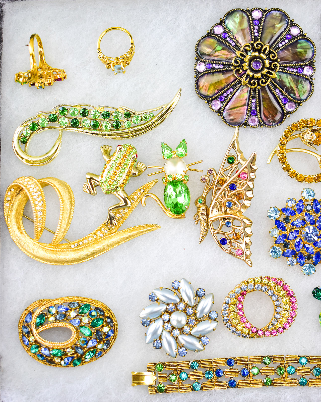 RHINESTONE COSTUME JEWLERY ASSORTMENT; ESTEE LAUDER, FLORENZA, JOAN RIVERS, ETC.