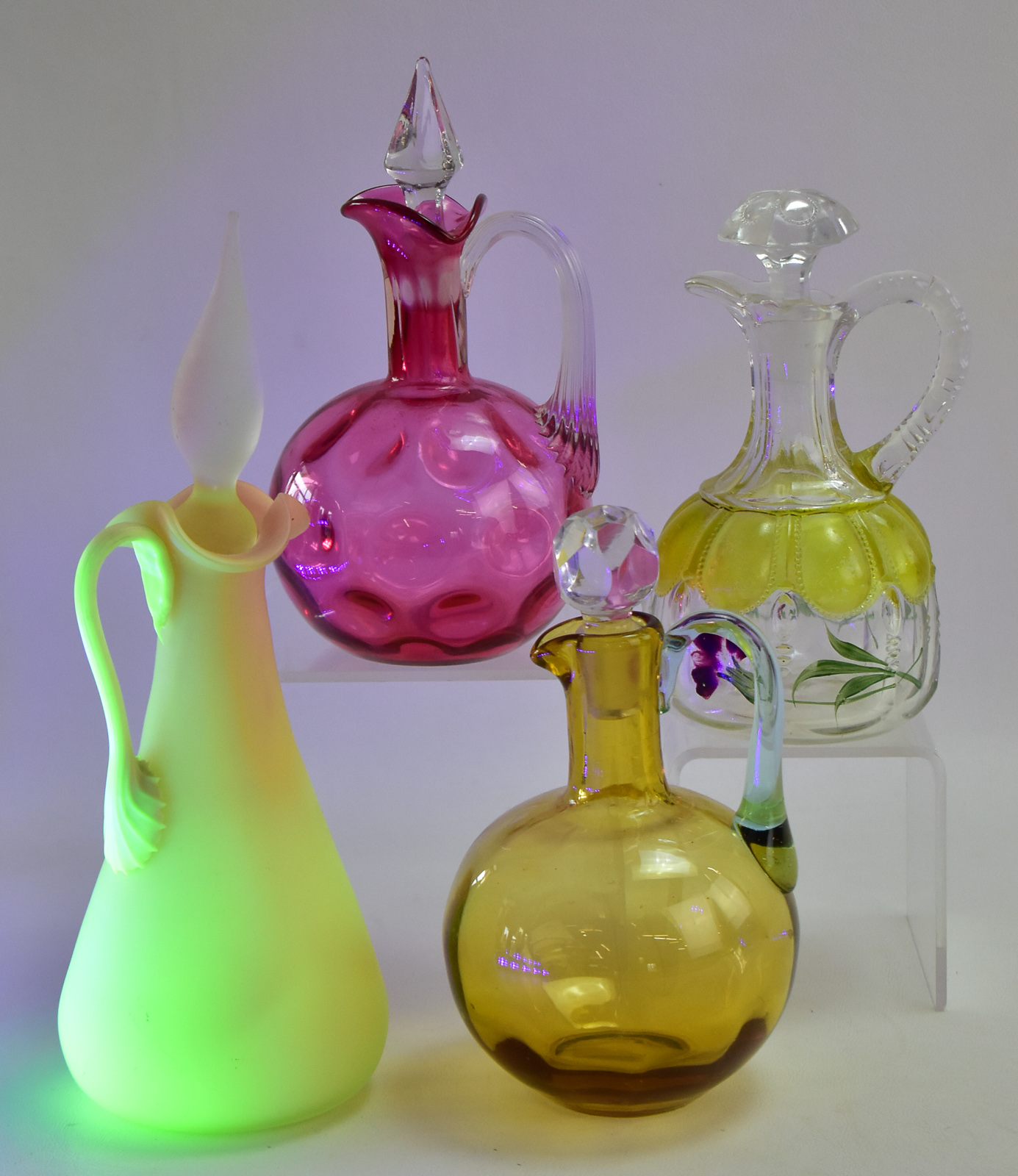 ASSORTMENT OF FOUR GLASS CRUETS