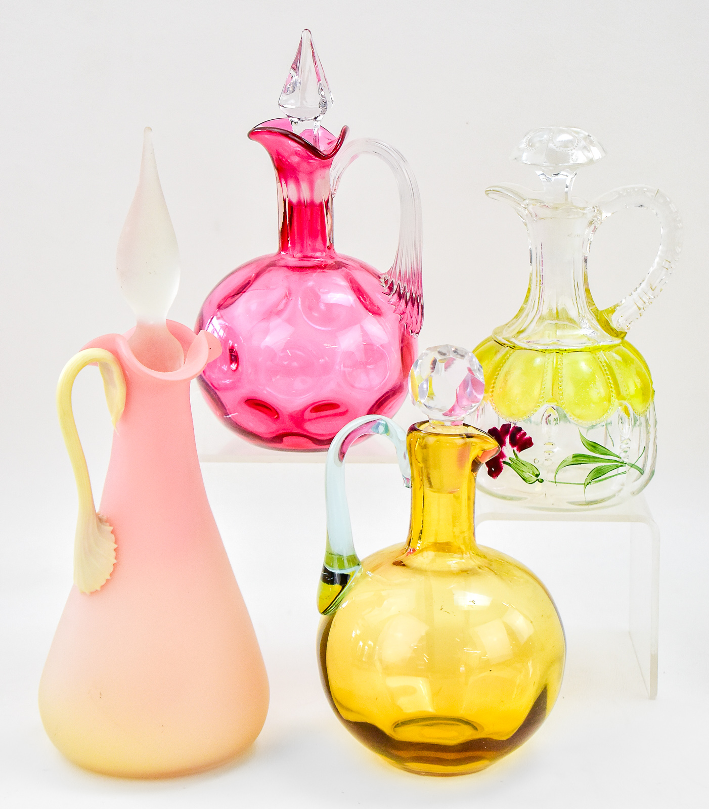 ASSORTMENT OF FOUR GLASS CRUETS