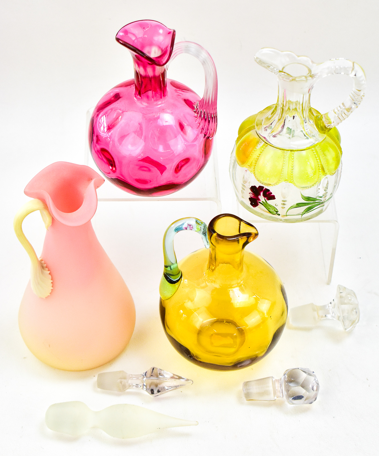 ASSORTMENT OF FOUR GLASS CRUETS