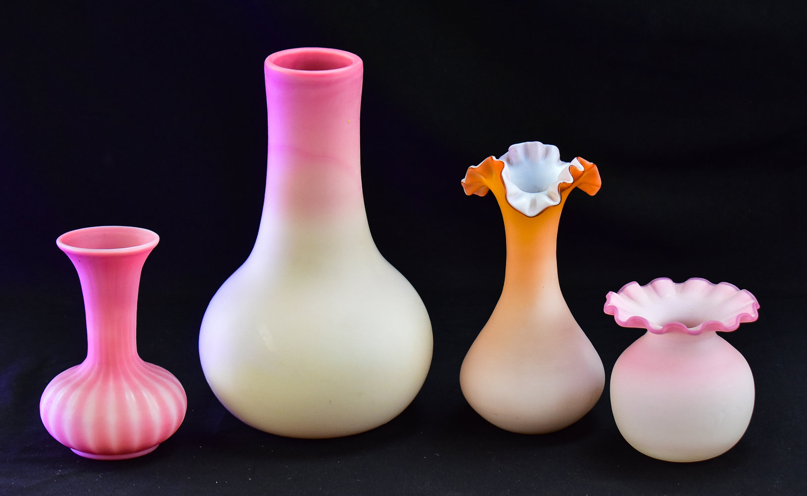 ASSORTMENT OF FOUR PINK SATIN GLASS VASES