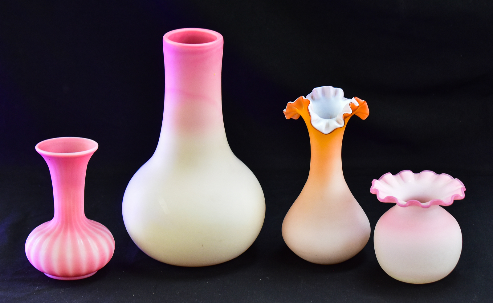 ASSORTMENT OF FOUR PINK SATIN GLASS VASES