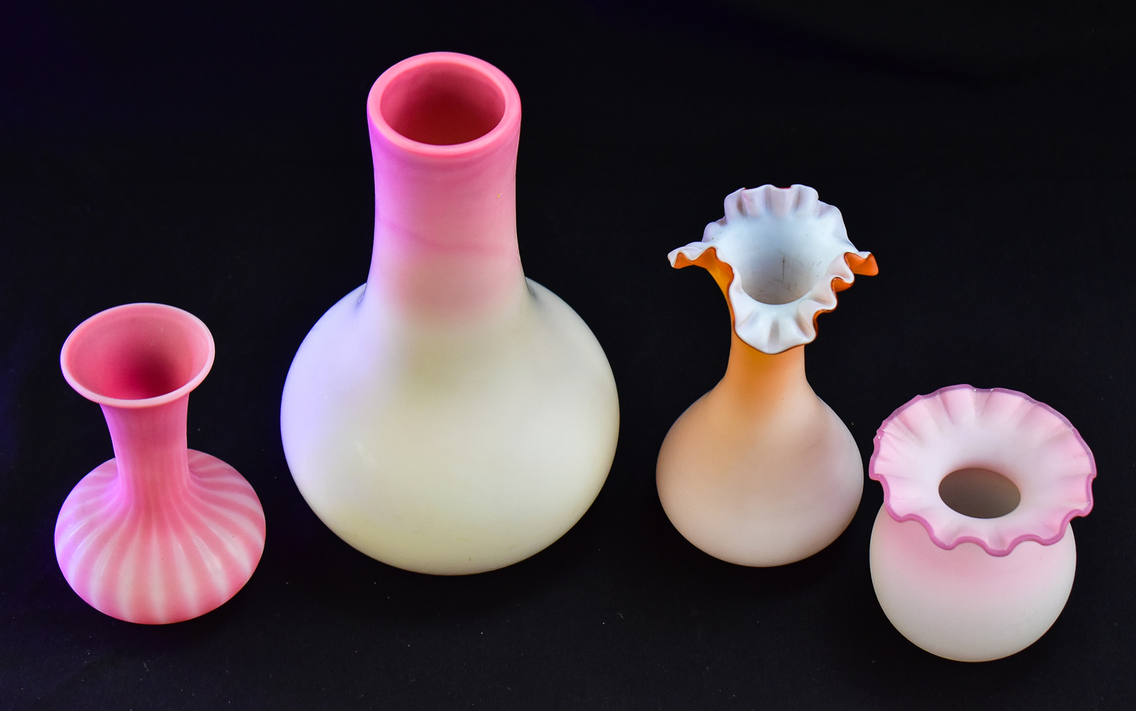 ASSORTMENT OF FOUR PINK SATIN GLASS VASES