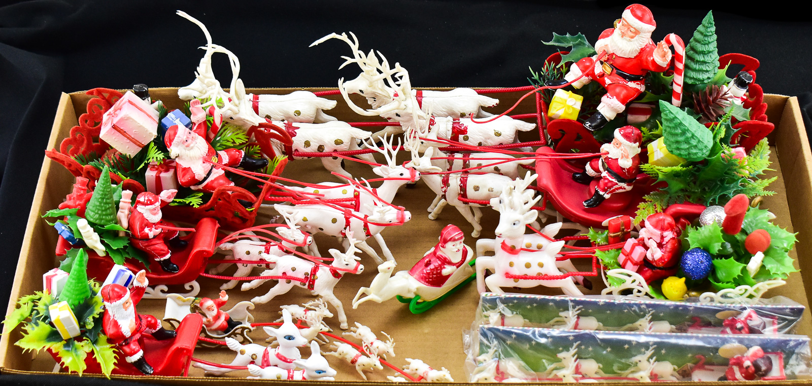 COLLECTION OF TABLE-TOP PLASTIC SANTA WITH SLEIGH & REINDEERS