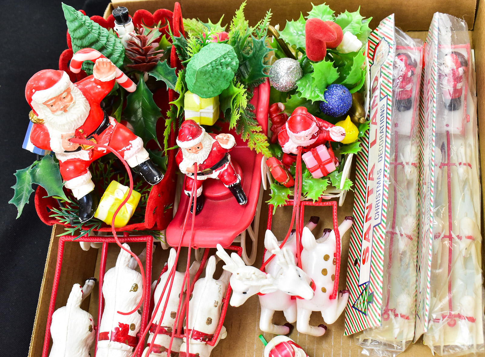 COLLECTION OF TABLE-TOP PLASTIC SANTA WITH SLEIGH & REINDEERS