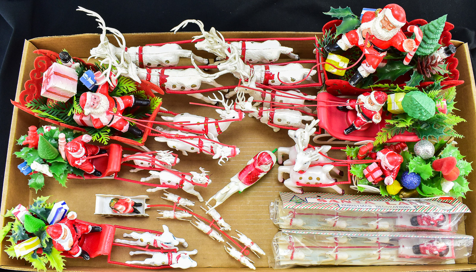 COLLECTION OF TABLE-TOP PLASTIC SANTA WITH SLEIGH & REINDEERS