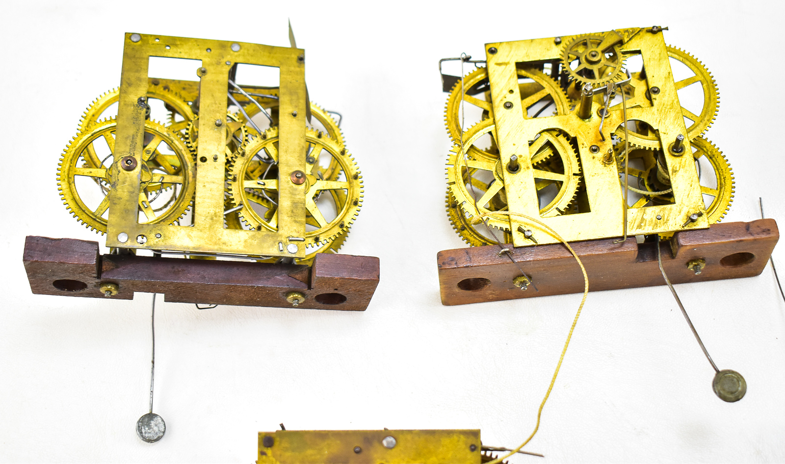 FIVE BRASS CLOCK MOVEMENTS