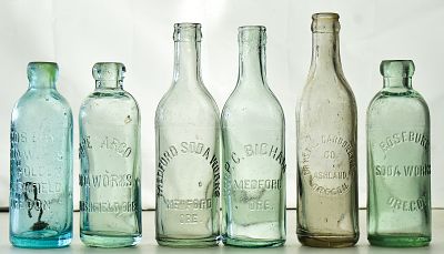 SOUTHERN OREGON GLASS BOTTLE ASSORTMENT: MARSHFIELD, ASHLAND, MEDFORD, ROSEBURG. This assortment 
