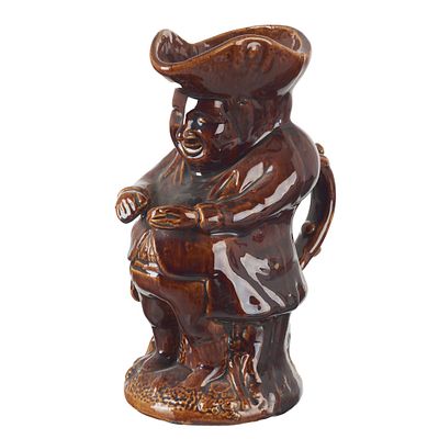 Earthenware Toby Jug. France, 19th century, in earthenware with a treacle glazed finish 