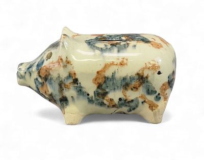 OHIO POTTERY PIG BANK. Early 20th century. Small piggy bank with mottled glaze, the rust and 