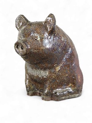 OHIO SEWER TILE PIG. Ohio, c. 1900, earthenware. A sewer tile pig in seated position with a coin 