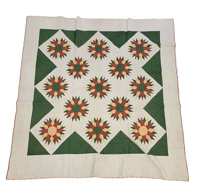 MARINER'S COMPASS QUILT. American, 1870s, cotton. A Mariner's Compass quilt composed of red 