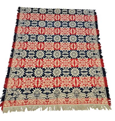 JACQUARD COVERLET. American, mid-19th century. A jacquard coverlet in blue, red, and white. 