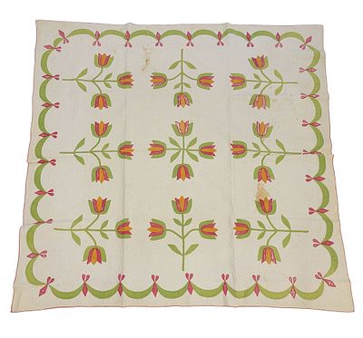 APPLIQUE TULIP QUILT. American, 19th century, cotton. An applique tulip quilt with flowers and 