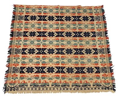 JACQUARD COVERLET. American, mid-19th century. A jacquard coverlet in green, red, indigo, and 