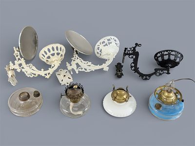 GROUP OF BRACKET LAMPS. American, 19th century, cast iron, brass, and glass. A group of kerosene 
