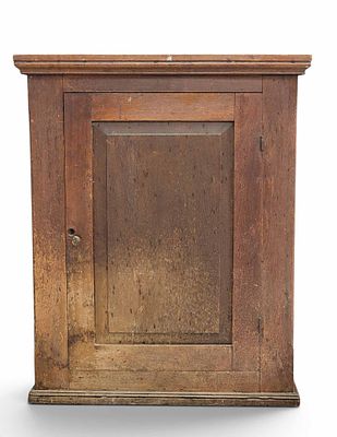 ZOAR, OHIO TABLETOP CUPBOARD. Late 19th century, walnut and poplar. Single paneled door and 
