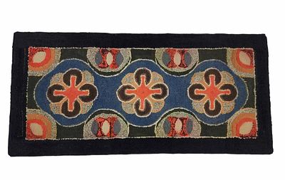 HOOKED RUG. American, 1st half-20th century. Colorful rug with stylized flowers on a black 
