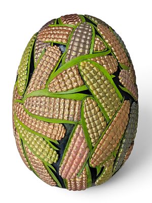 CARVED EGG BY GENE KANGAS (OHIO, B. 1944). Signed and dated 2021. A large egg with relief-carved 