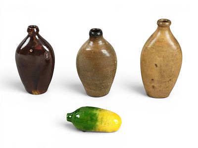 FOUR POTTERY FLASKS. 19th century. Includes three flattened stoneware flasks (one with cobalt 