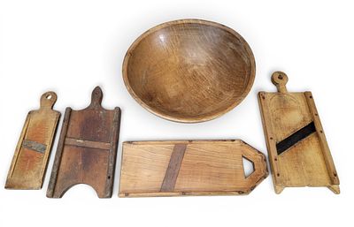 WOODEN BOWL AND GROUP OF SLAW CUTTERS. American, 19th century. Includes a curly maple 20.5" 