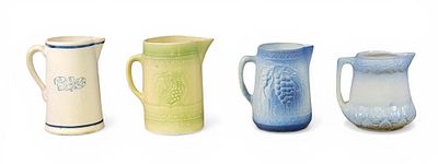 FOUR STONEWARE PITCHERS. American, early 20th century. Three molded pitchers, one with Dutch 