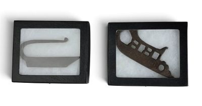 TWO WROUGHT IRON STRIKERS. 19th century. A simple example, 4.25" long; together with a fancy 