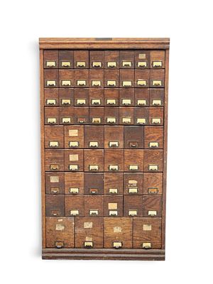 BICYCLE SHOP PARTS CABINET. American, early 20th century, pine. Vertical case of 80 drawers 