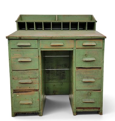 GREEN-PAINTED FOREMAN'S DESK. American, 1910-1930, pine. With cubbies, nine drawers, and a 