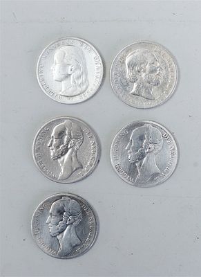 Collection of four Dutch 1 guilder coins from the 19th century, bearing the years 1846, 1848 