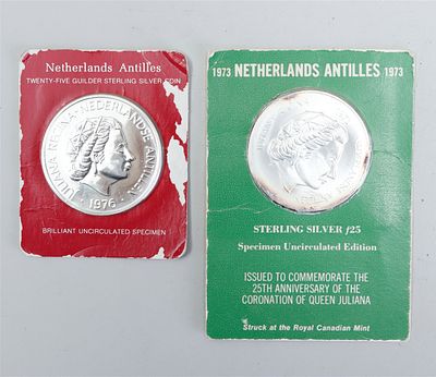 Two silver 25 guilder commemorative coins from the Netherlands Antilles, bearing the years 1973 