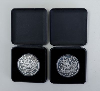 Two Dutch 50 guilder commemorative coins, issued on the occasion of the Treaty of Maastricht.