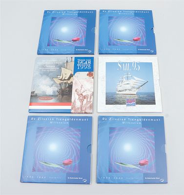 Collection of four silver Millennium commemorative coins, including coins with the themes Sail 